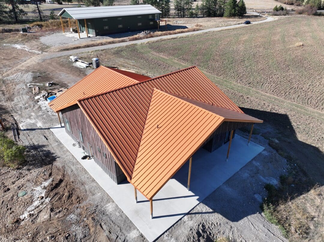 The roofline of this metal building's lean-to is integrated with the rest of the pole barn