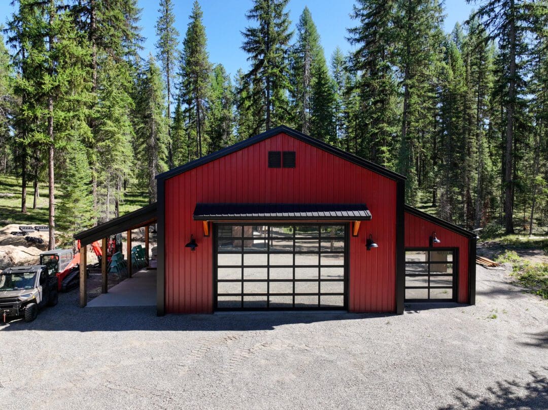32×48 post-frame shop with black siding and red gables in Colville, WA