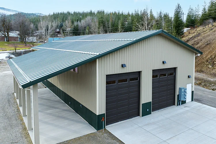 A commercial metal building features a large pole barn lean-to