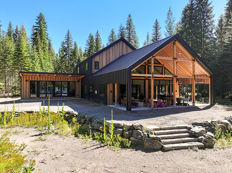 A beautiful barndominum with large windows and spacious living quarters