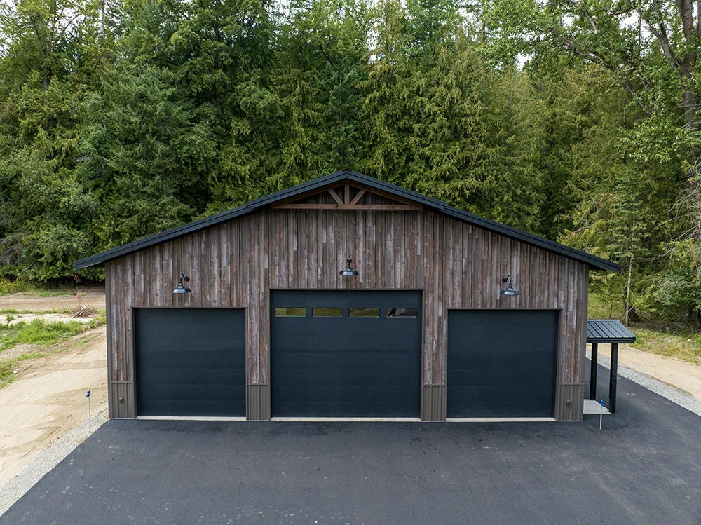 A metal building in Sagle, Idaho features metal siding that looked like aged wood
