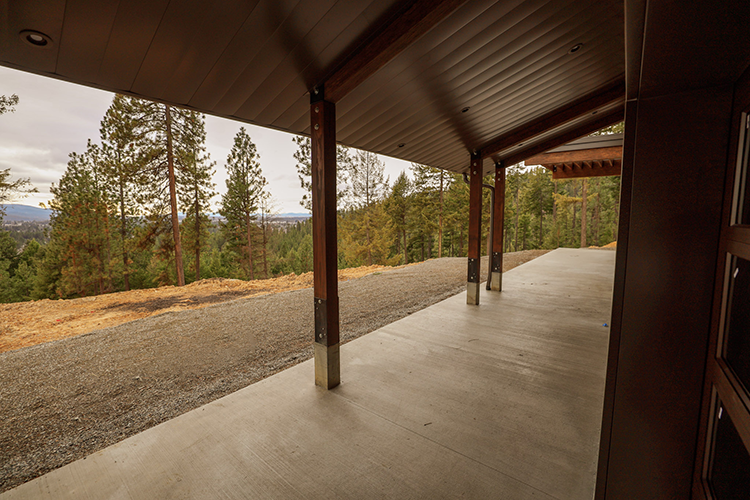 This lean to porch features an attractive wood looking ceiling