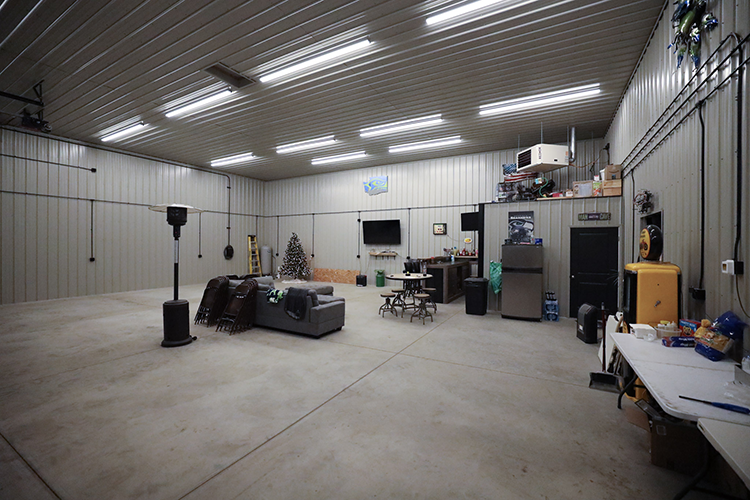 The interior of an insulated and well lit hobby shop, with a corner used as a man cave