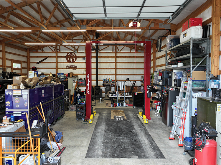 This hobby shop interior has a workshop area and a place to work on cars