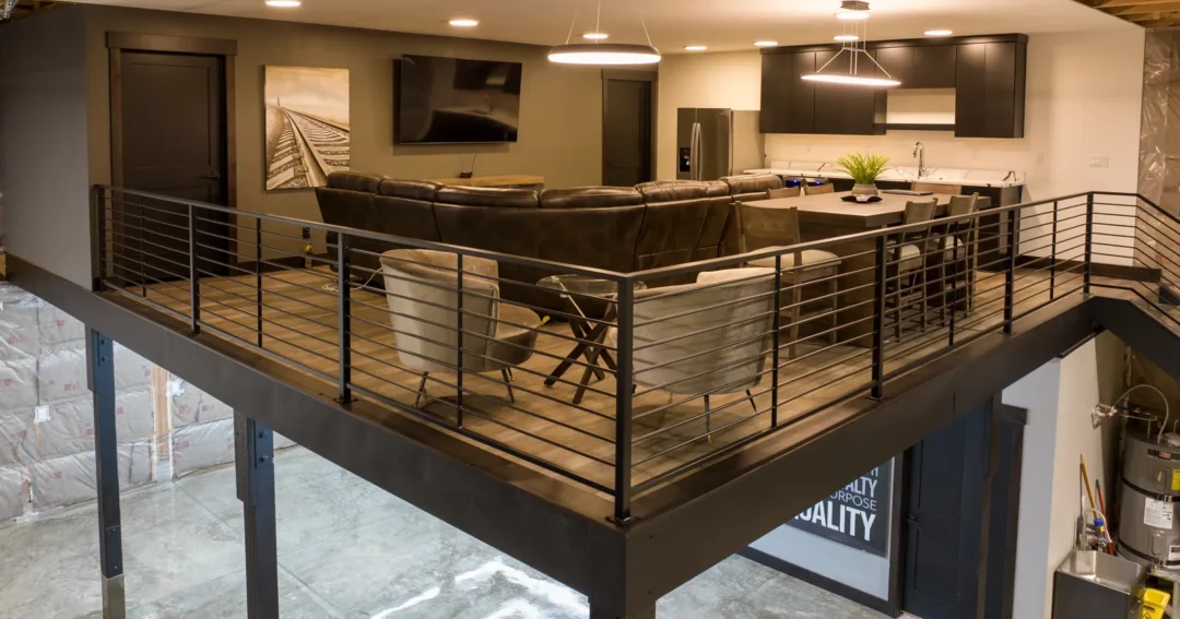 A loft in a pole barn garage gives a separates living area