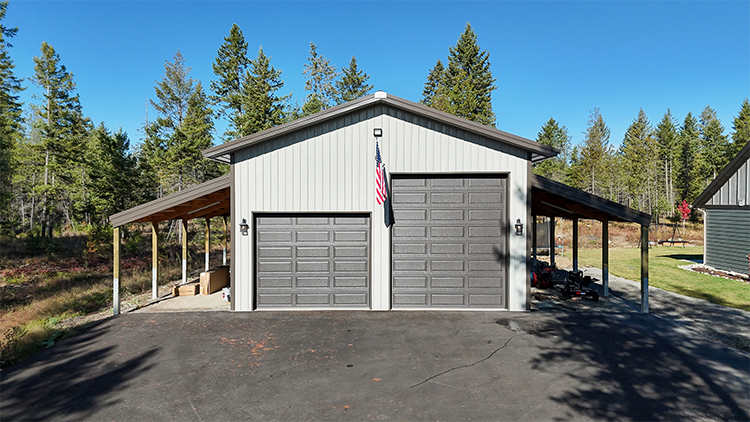 A metal building features two lean-to additions