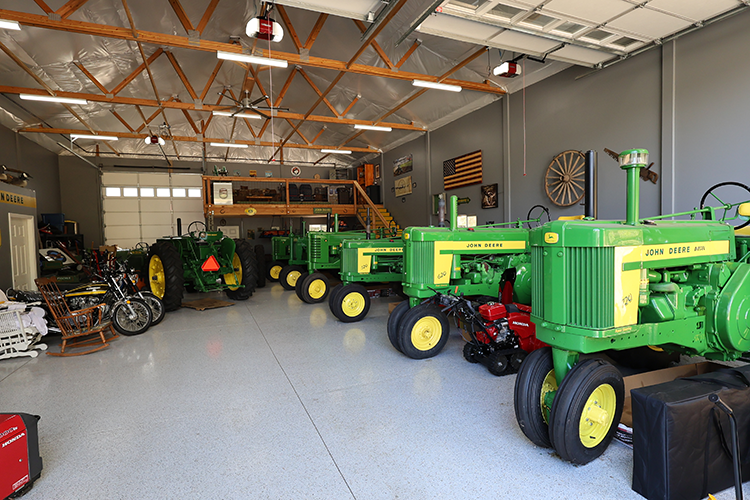 A post frame workshop has a perfect layout to display a tractor collection