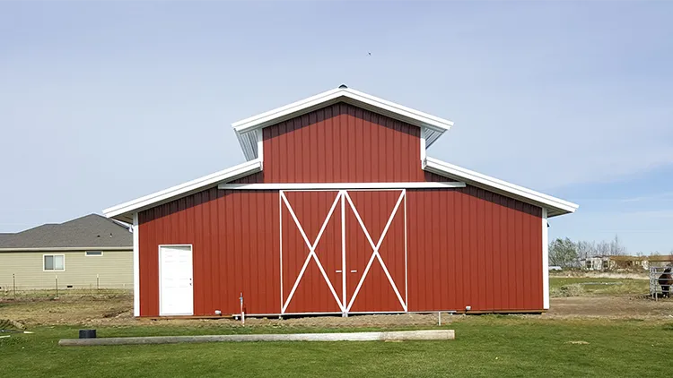A beautiful red pole barn with an aesthetic to increase property value