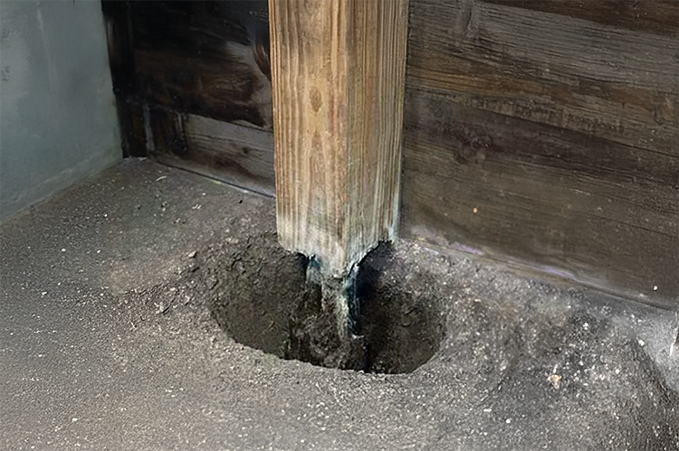 A rotted post for a pole barn
