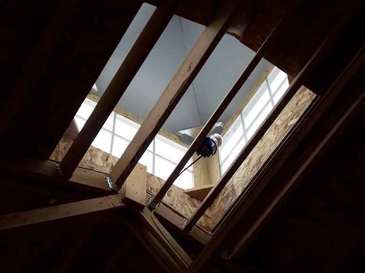 A closeup of venting in a polebarn in the form of a vent cap