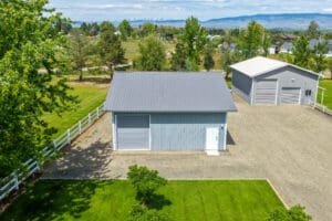 A detached garage from Steel Structures America. Grey and blue in color