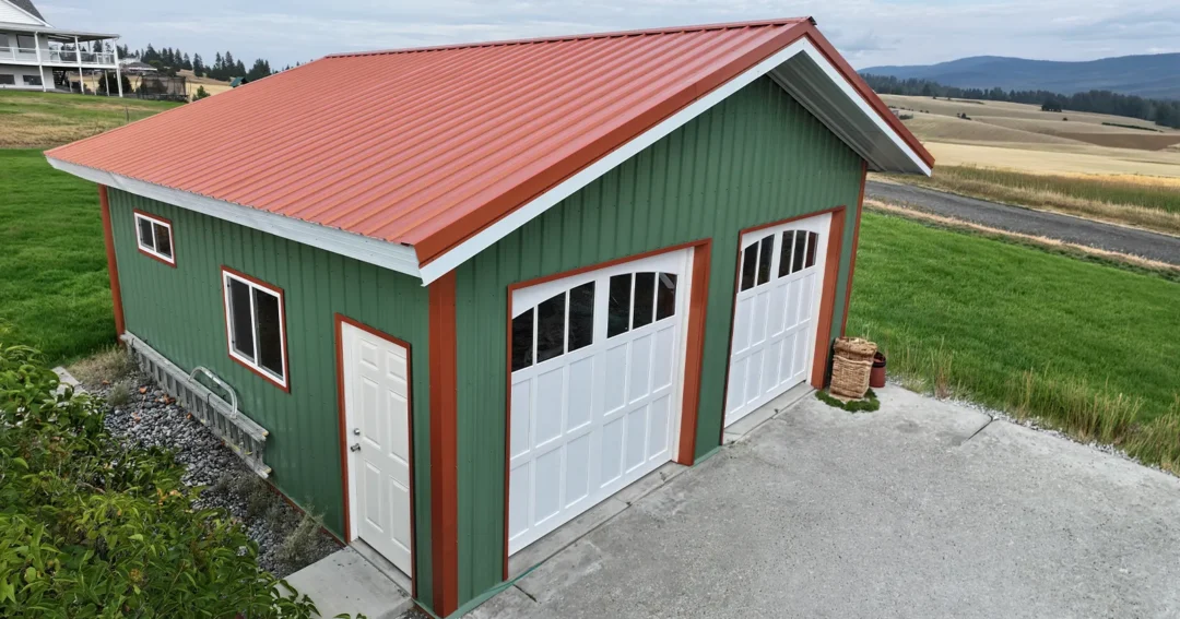 This building could be used as a garage or ADU, green with red trim and white doors, only the interior styling determines it's use