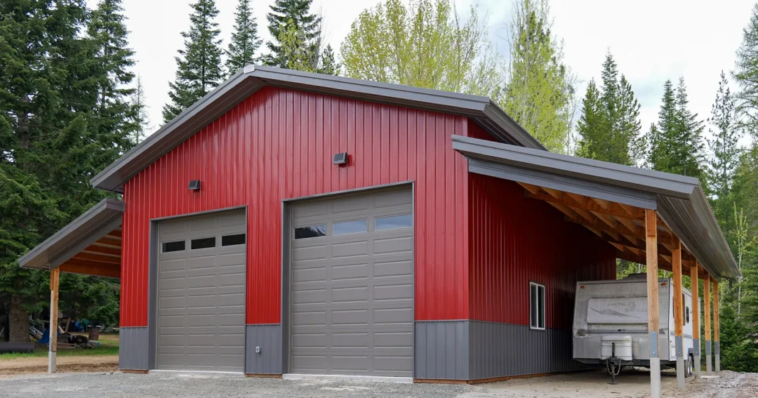 A red pole barn with lean to using perma column footings