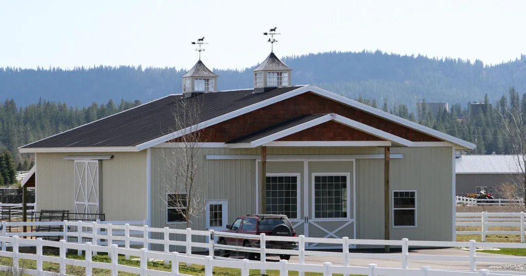 A barn cupola on the roofline of a post-frame building for ventilation and a finished look