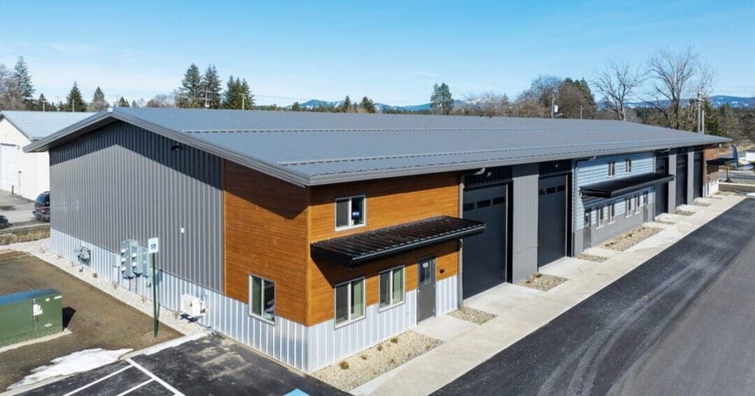 Multi-tenant commercial steel building by Steel Structures America, the kind of span red iron metal buildings target