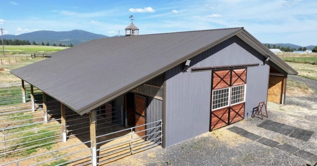 The front corner of a horse barn in Chattaroy, Washington built by the horse barn builders at Steel Structures America