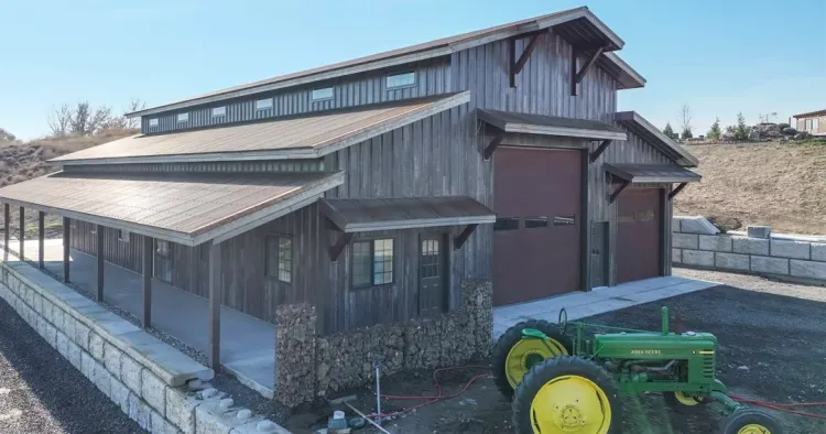 Finished post-frame building with wood-look steel siding, a finish option shared with red iron metal buildings