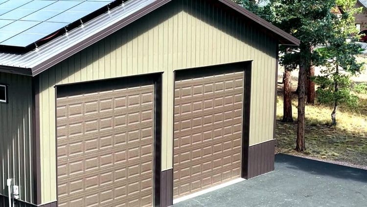 Two garage door bays with tan panels and brown trim, a common door layout for a 30x40 metal building