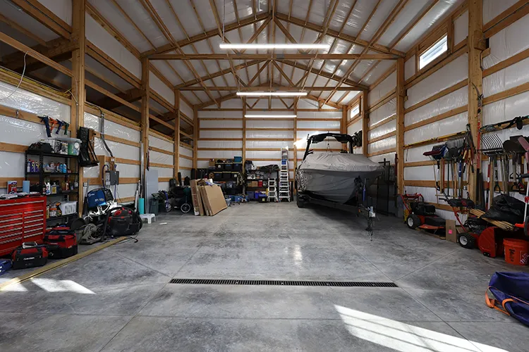Interior shelving with tools and gear in a custom shop, the kind of storage a 30x50 steel building fits