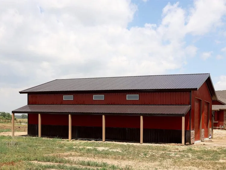 A finished 40 x 60 x 16 RV garage in Parker, CO with a tall overhead door built by RV garage builders