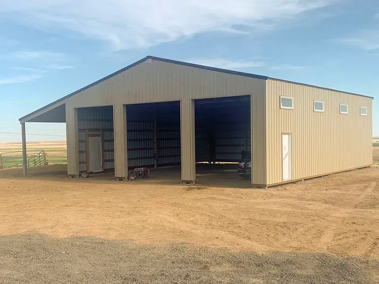 Farm equipment stored behind tall doors in a metal building, a common use for a 40x100 pole barn
