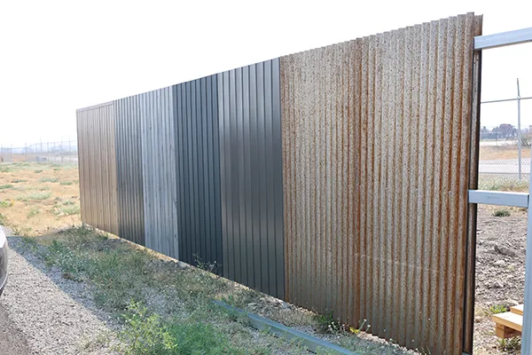 A wall of different metal fencing options from metal america