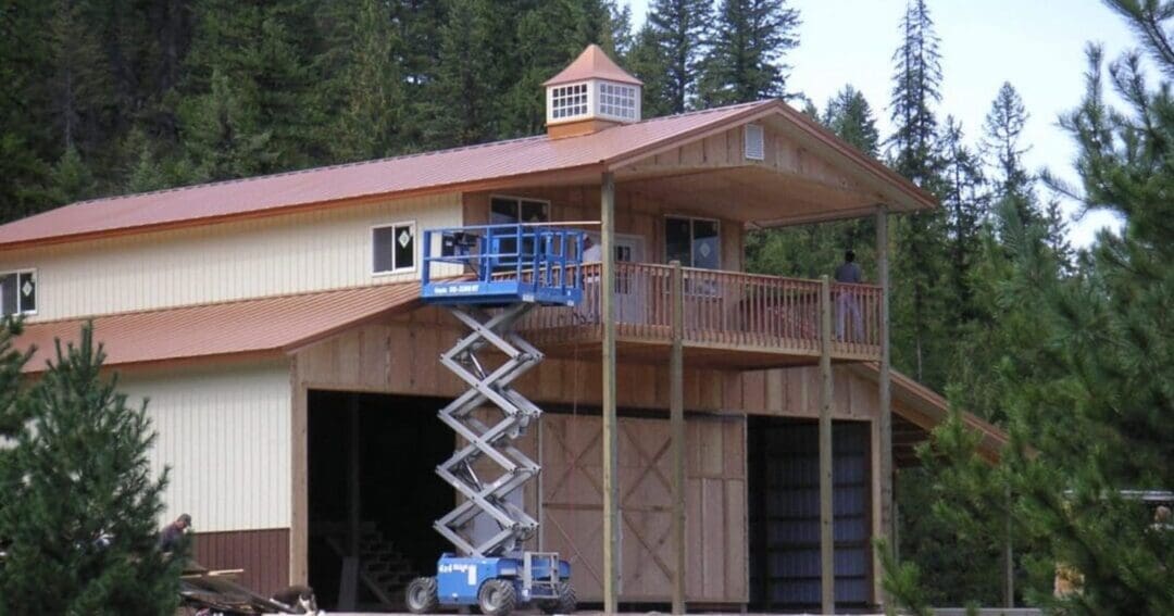 A post-frame building under construction, the work of an experienced pole barn builder