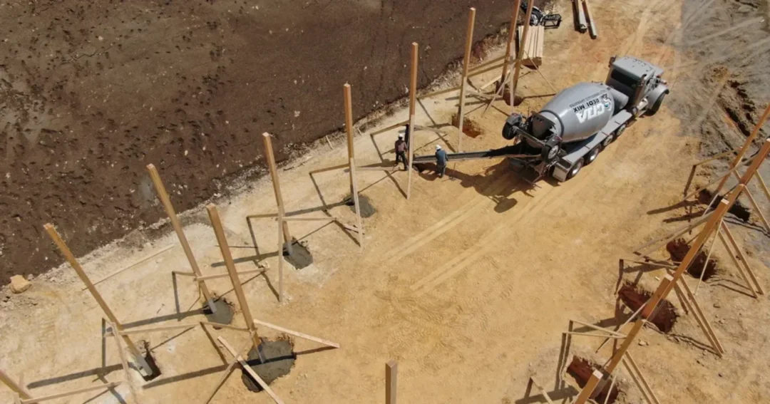 Pole barn posts set with Perma-Column and concrete, the two main options for poles for pole barn builds