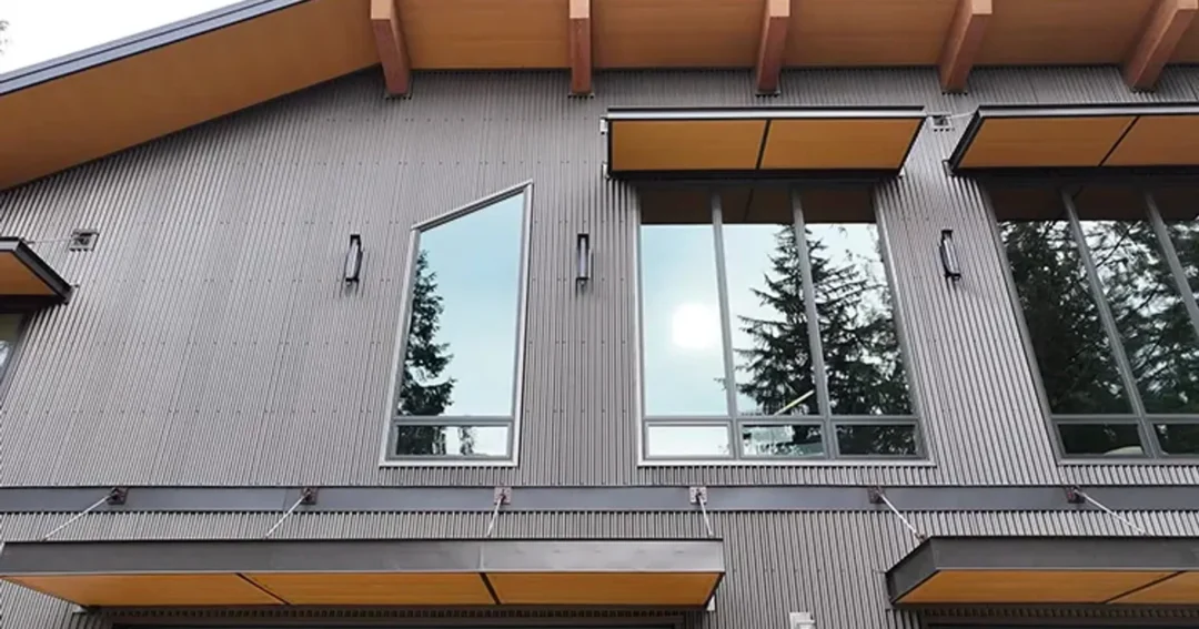 Steel building windows on a brown post-frame building, bringing daylight into the structure