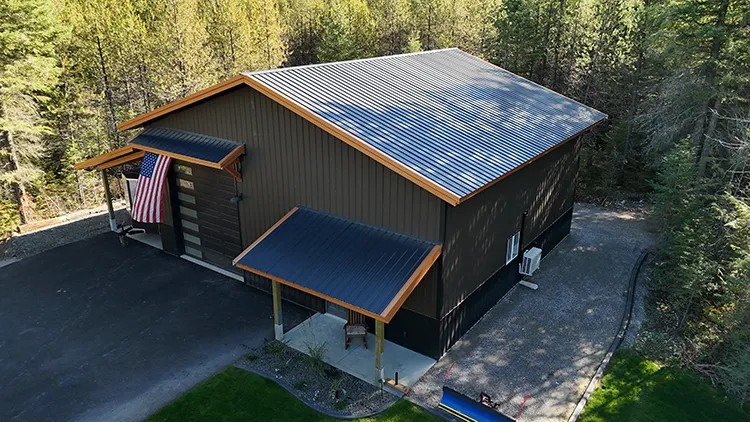 A dark brown shop building with light tan trim, a finish combination that works well on a 40x40 metal building