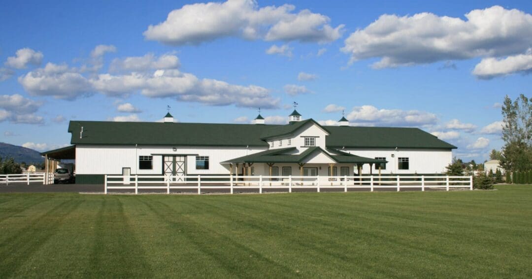 The front corner of a custom horse barn with living quarters built by Steel Structures America in Washington