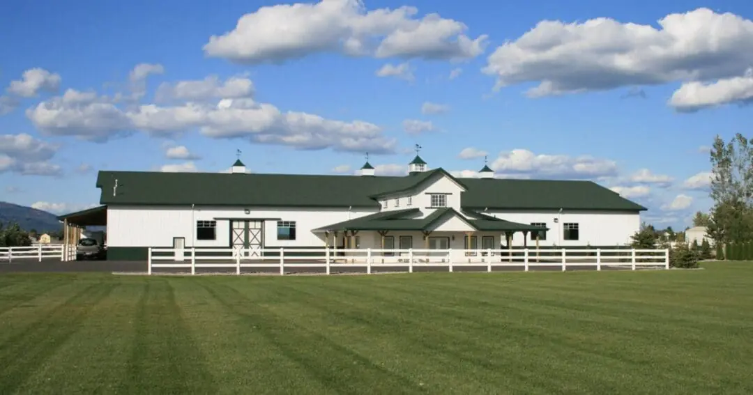 The front corner of a custom horse barn with living quarters built by Steel Structures America in Washington