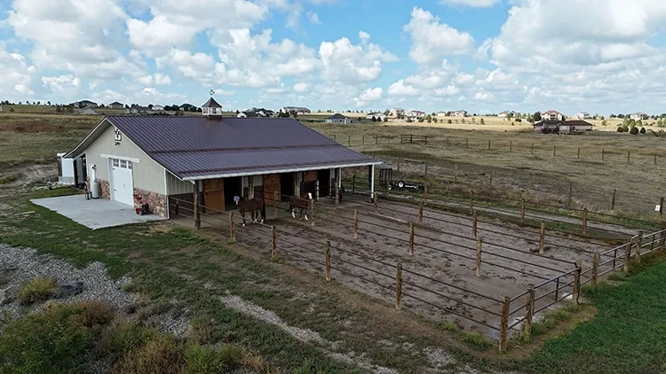 Custom horse stalls opening onto an outdoor pen, the shed row layout that suits a 10x30 horse barn