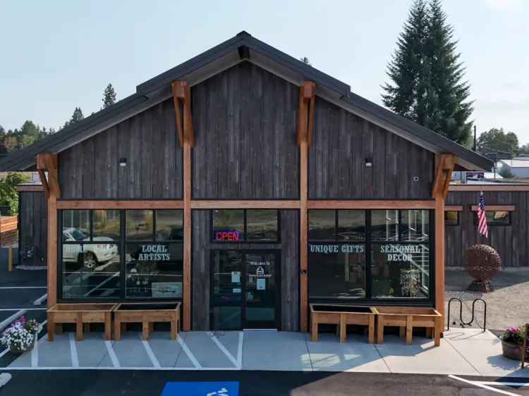 Custom steel buildings in Hayden, Idaho: a commercial addition with Old Town Gray siding and a Burnished Slate roof