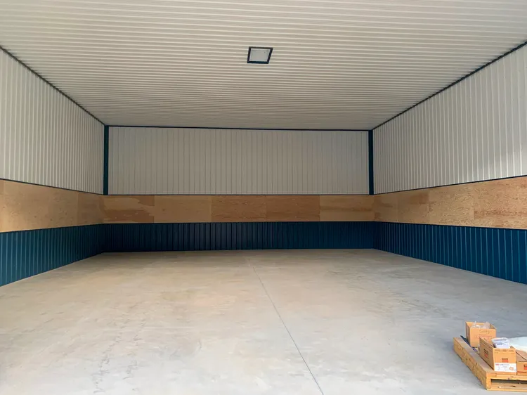 40x60 post-frame shop in Coeur d'Alene, Idaho with an open lean-to, a good layout for a home business shop building