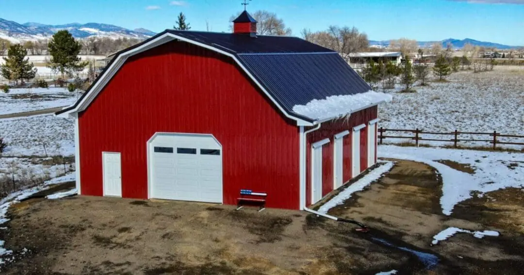 Gambrel roof pole barn in Longmont, Colorado, showing the two-slope roofline a gambrel truss creates