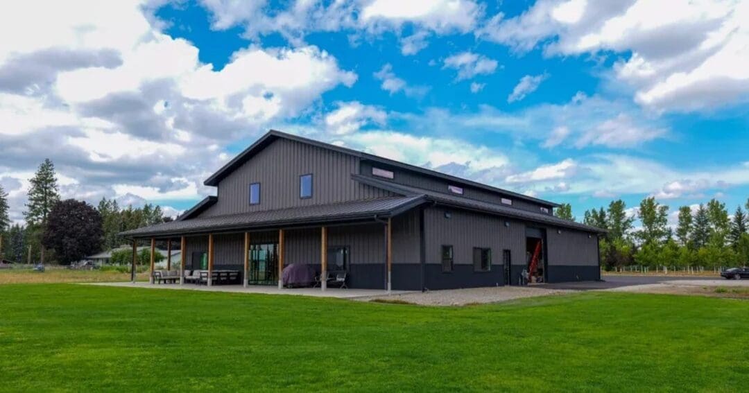 Modern barndominium on a farm property with steel roofing and siding, built by Steel Structures America