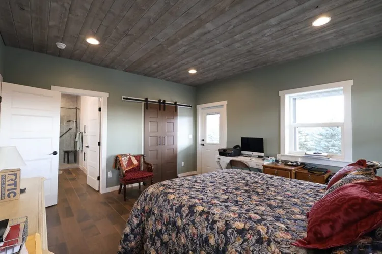 Bright, open great room inside a custom barndominium with a farmhouse-style interior finish
