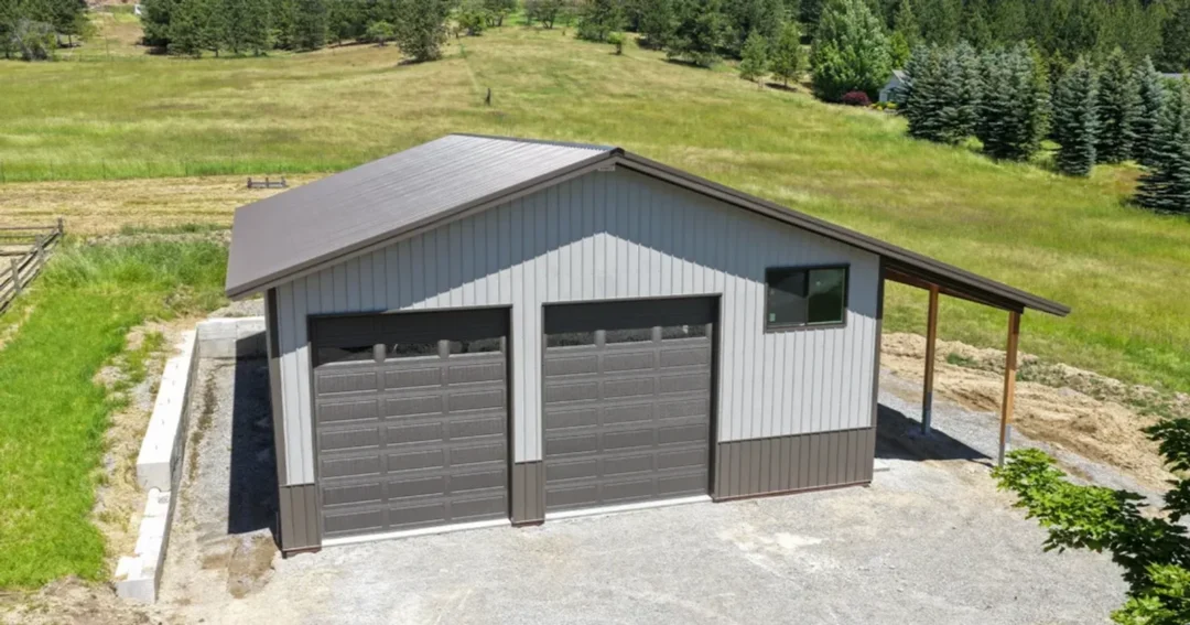 Two-tone custom pole barns get their look from a contrasting wainscot band around the base of the walls